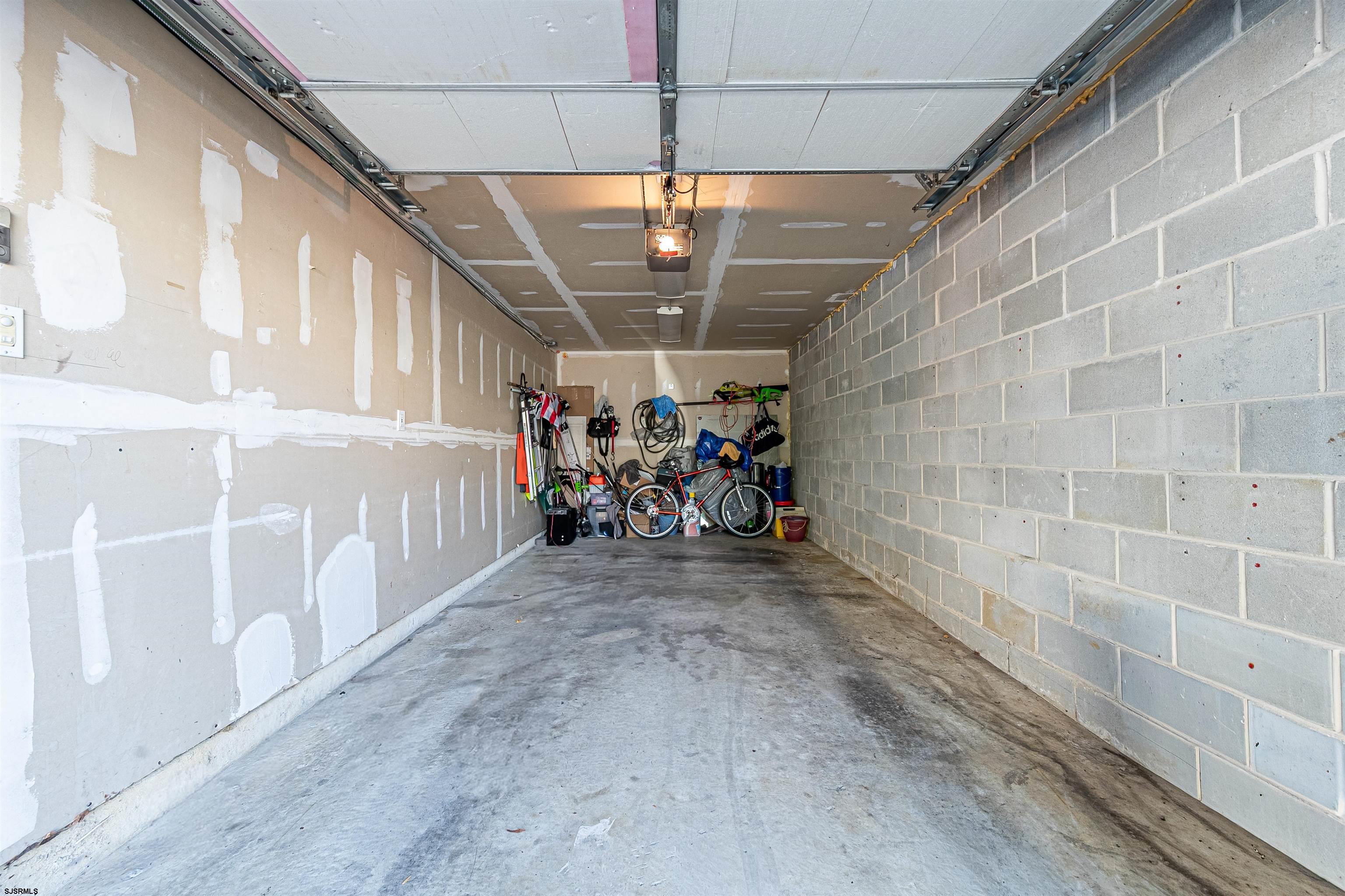 22 Millstream Road, Unit 22 Clementon, NJ 08021 - Photo 28 of 28 a view of a hallway with a table and chairs