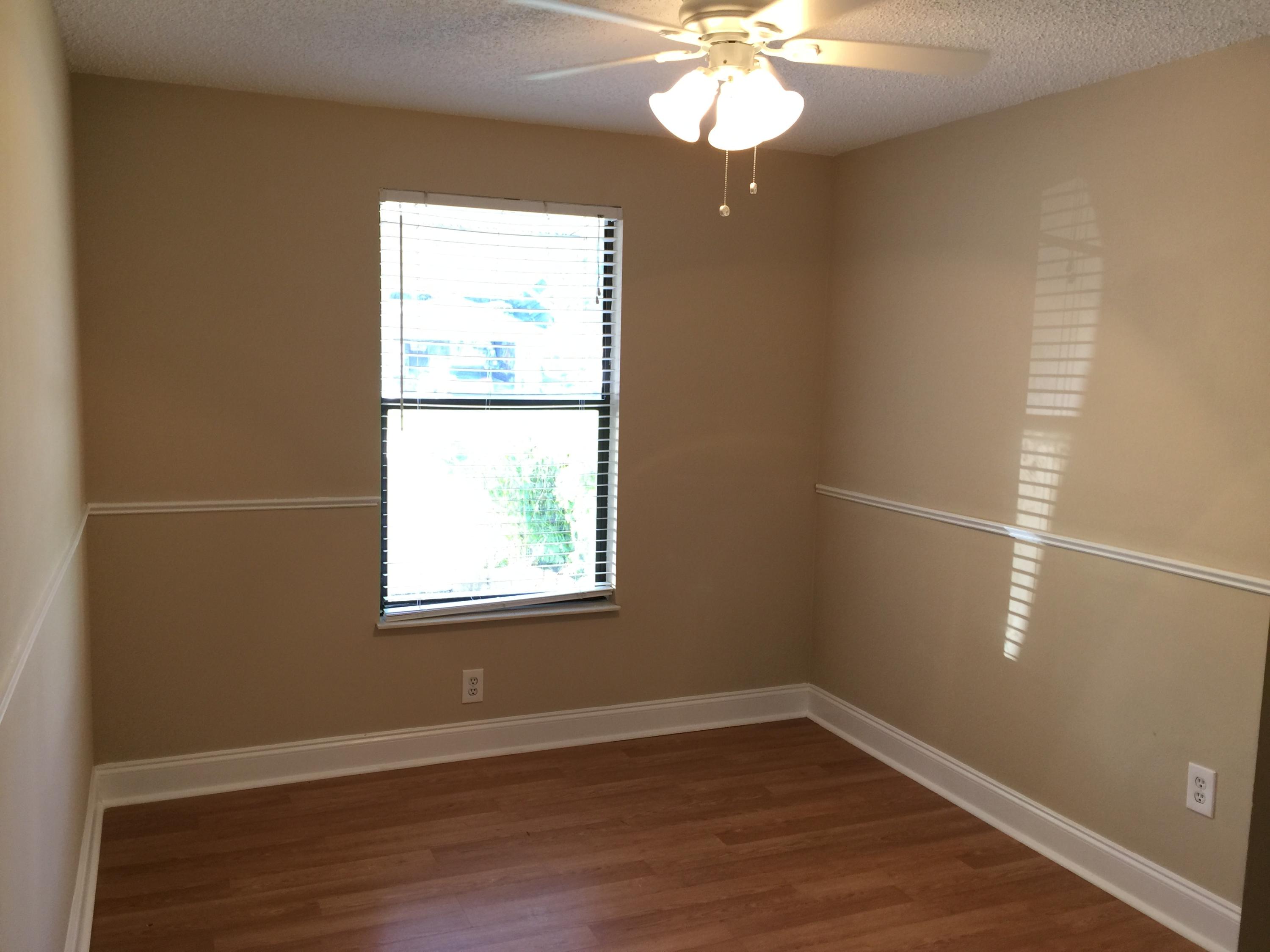 5266 Steven Road Boynton Beach, FL 33472 - Photo 12 of 26 an empty room with wooden floor and windows