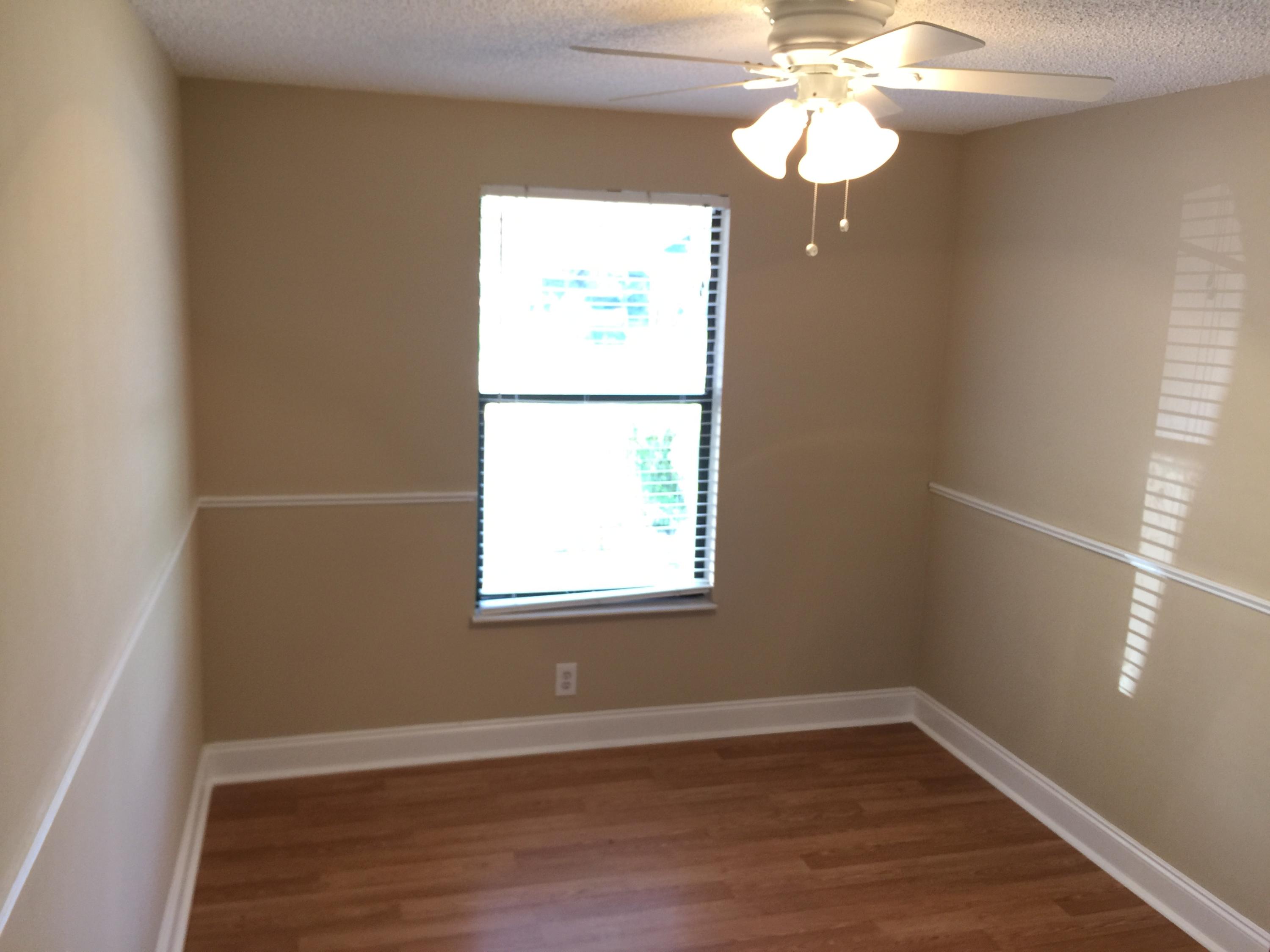 5266 Steven Road Boynton Beach, FL 33472 - Photo 14 of 26 a view of an empty room with wooden floor and a window
