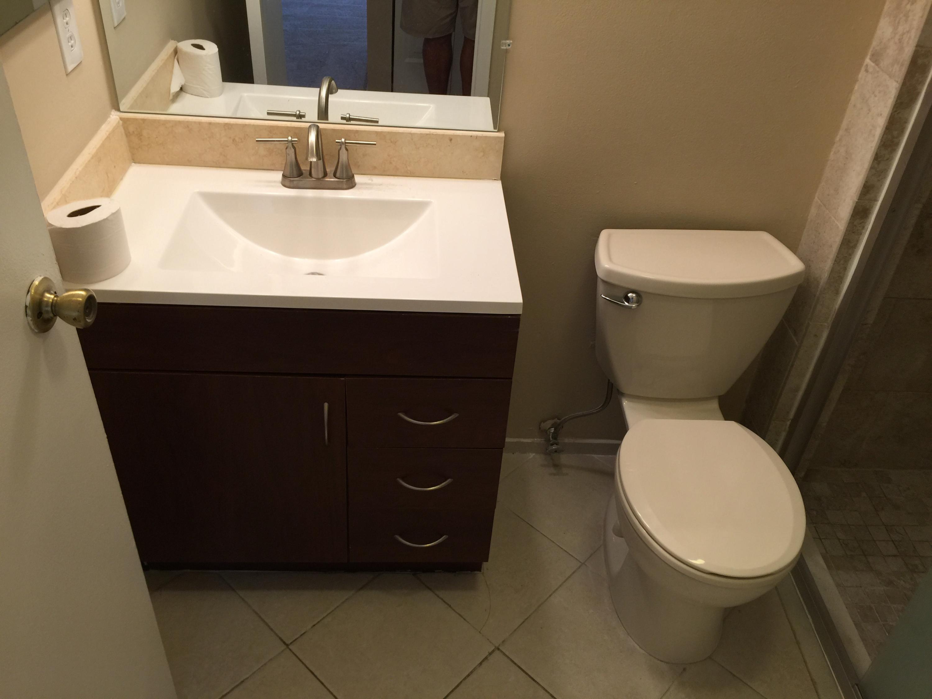 5266 Steven Road Boynton Beach, FL 33472 - Photo 18 of 26 a bathroom with a toilet and a sink