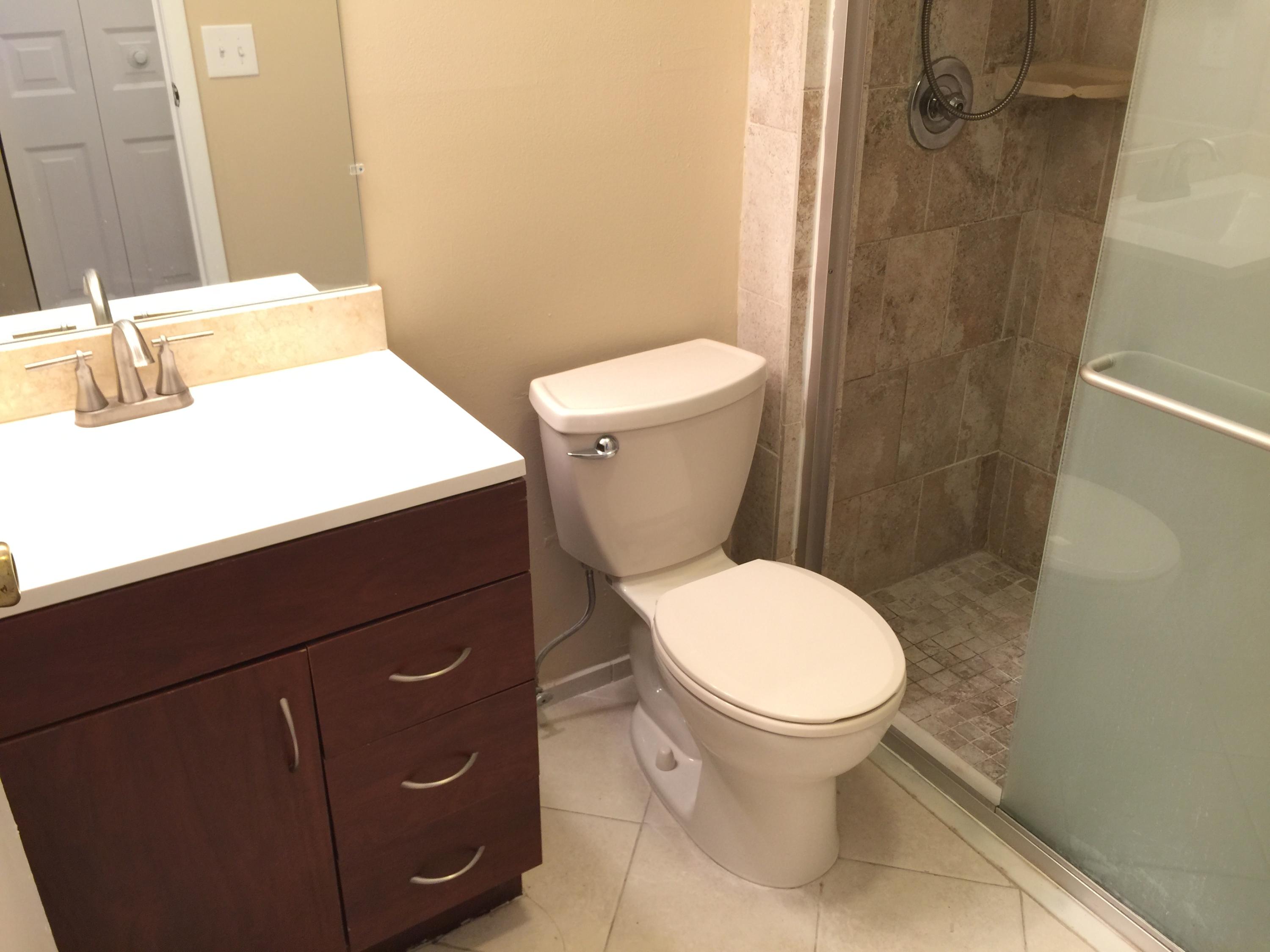 5266 Steven Road Boynton Beach, FL 33472 - Photo 19 of 26 a bathroom with a toilet and a sink