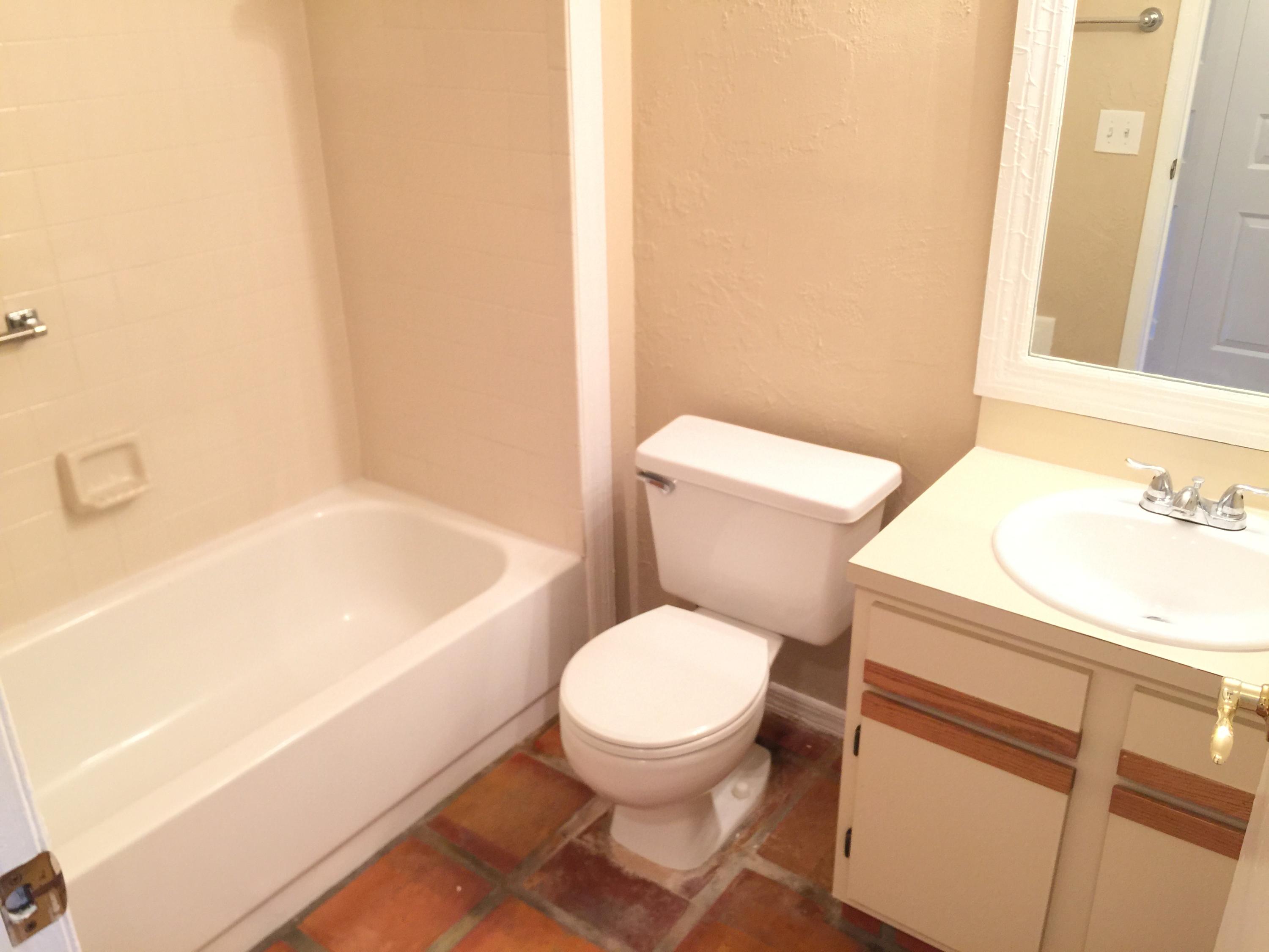 5266 Steven Road Boynton Beach, FL 33472 - Photo 20 of 26 a white toilet sitting next to a bath tub