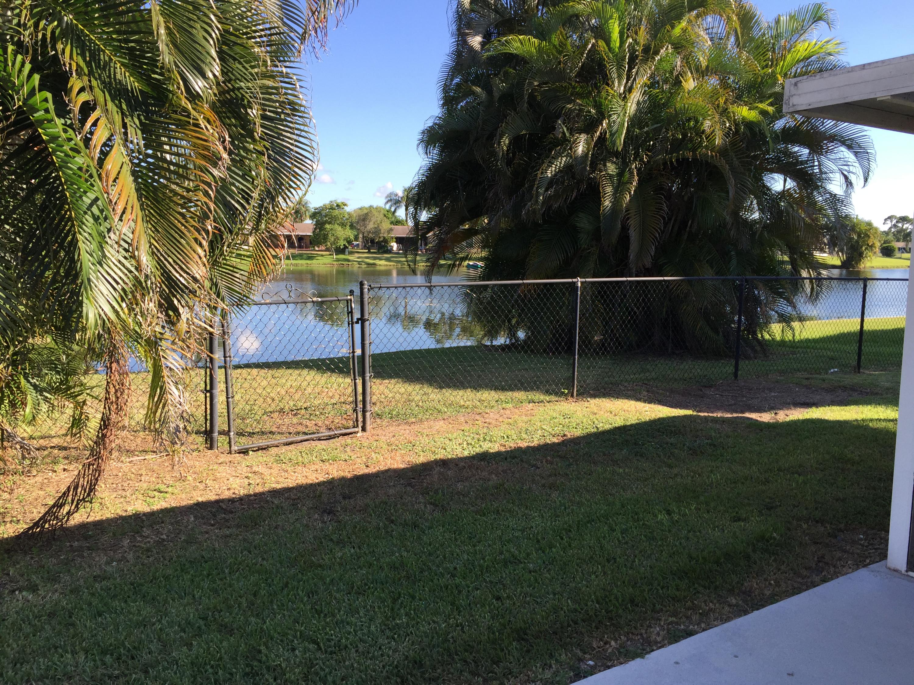 5266 Steven Road Boynton Beach, FL 33472 - Photo 23 of 26 a view of a garden with a slide