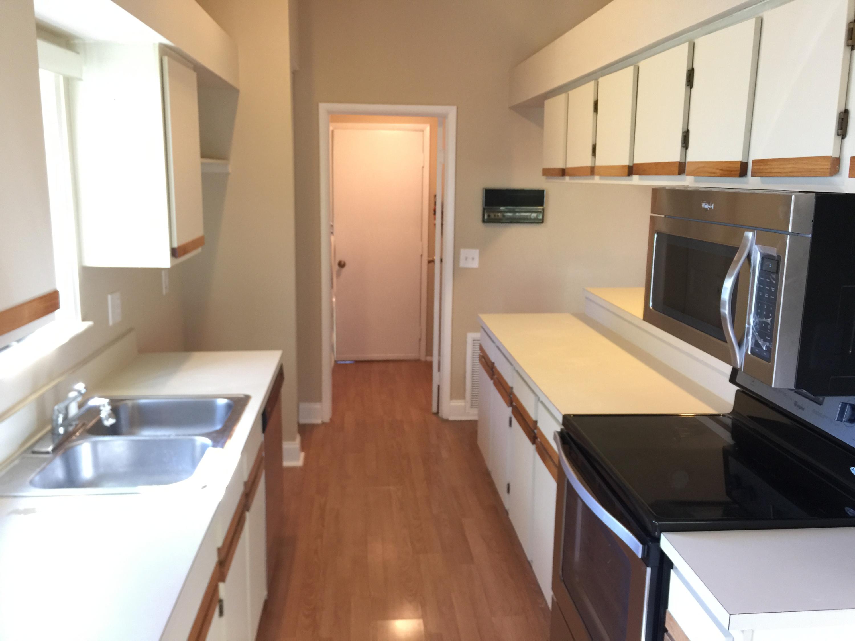 5266 Steven Road Boynton Beach, FL 33472 - Photo 9 of 26 a kitchen with stainless steel appliances a stove a sink and a refrigerator