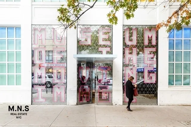 a view of a building on a street