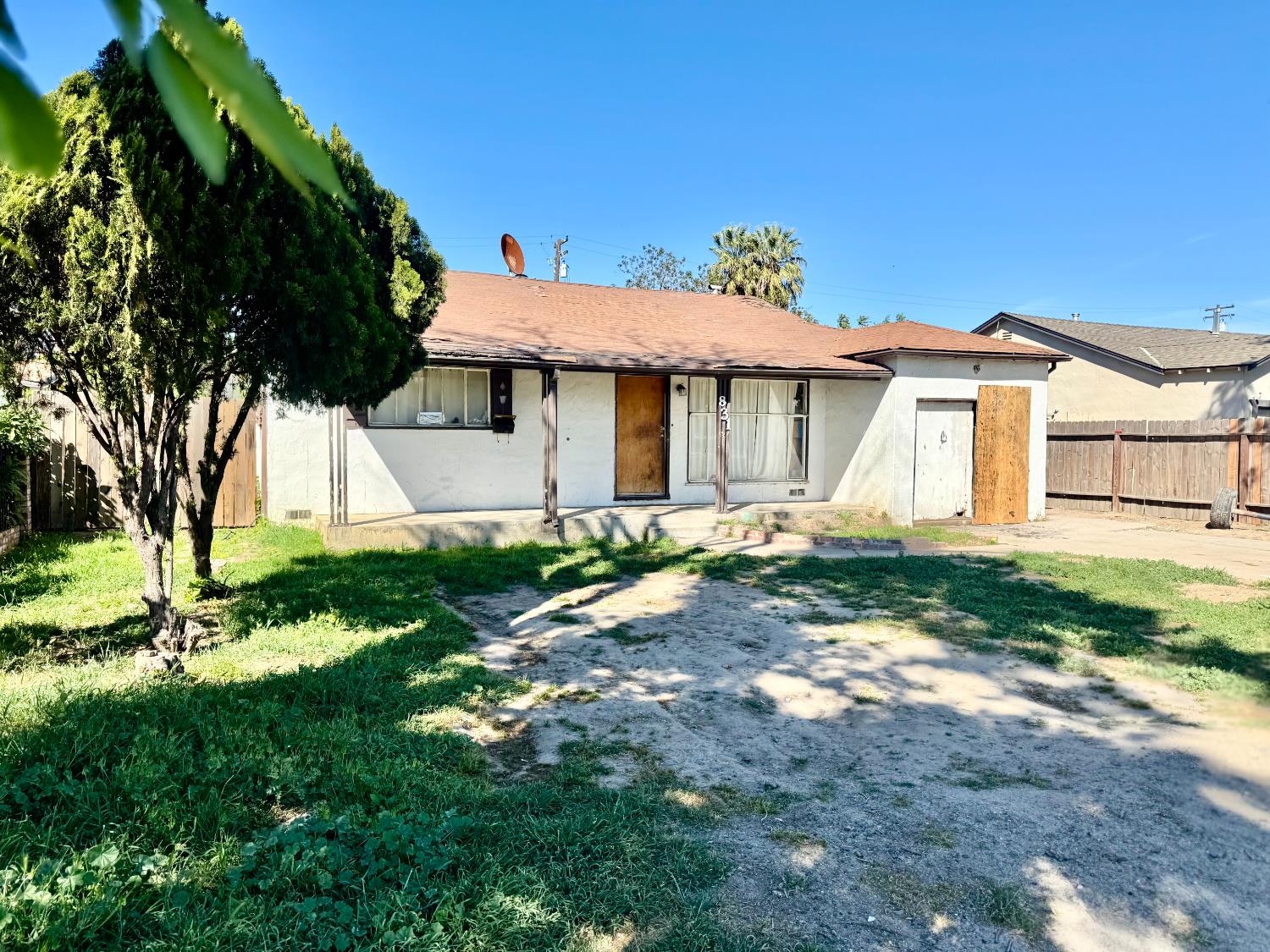 831 Elm Avenue Modesto, CA 95351 - Photo 3 of 3 a view of a house with a yard