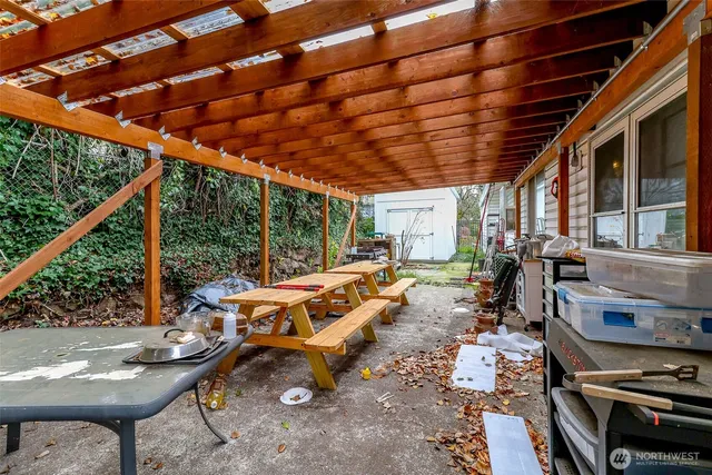 a backyard of a house with outdoor seating