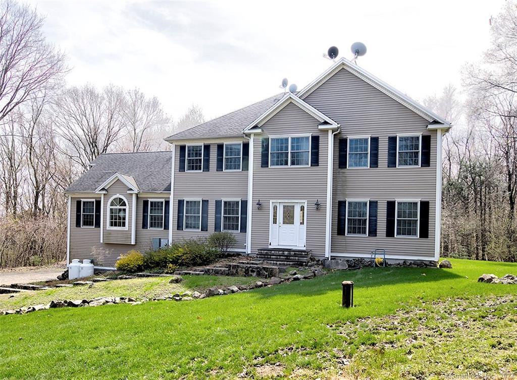 651 Carrington Road Bethany, CT 06524 - Photo 1 of 1 a front view of a house with a yard and porch