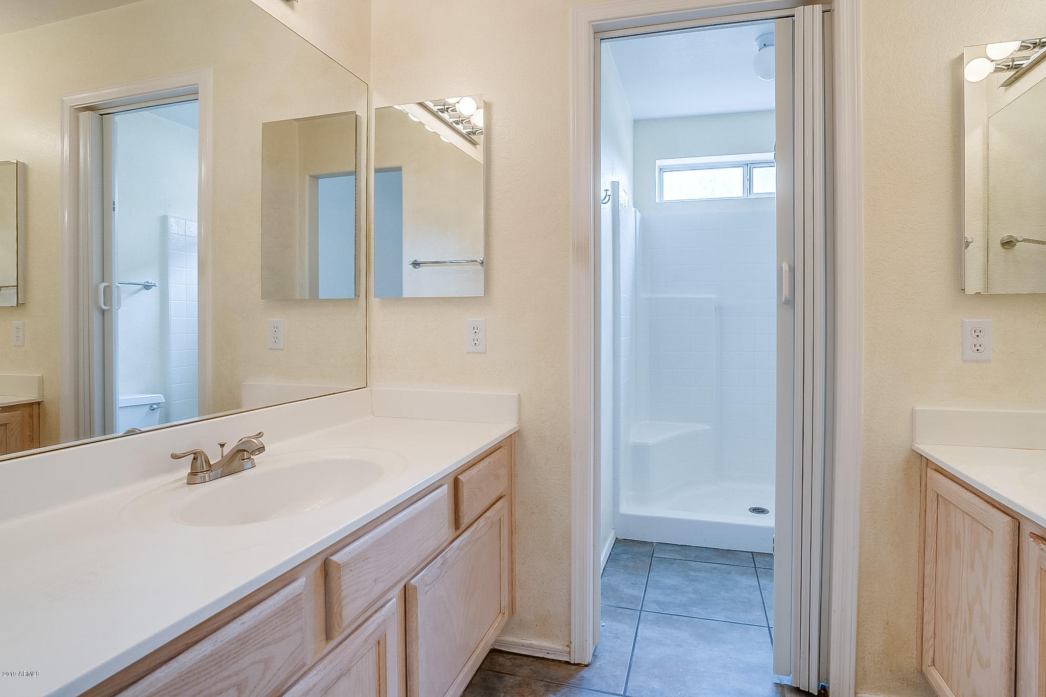 430 West Colt Road Tempe, AZ 85284 - Photo 12 of 18 a bathroom with a sink and a mirror