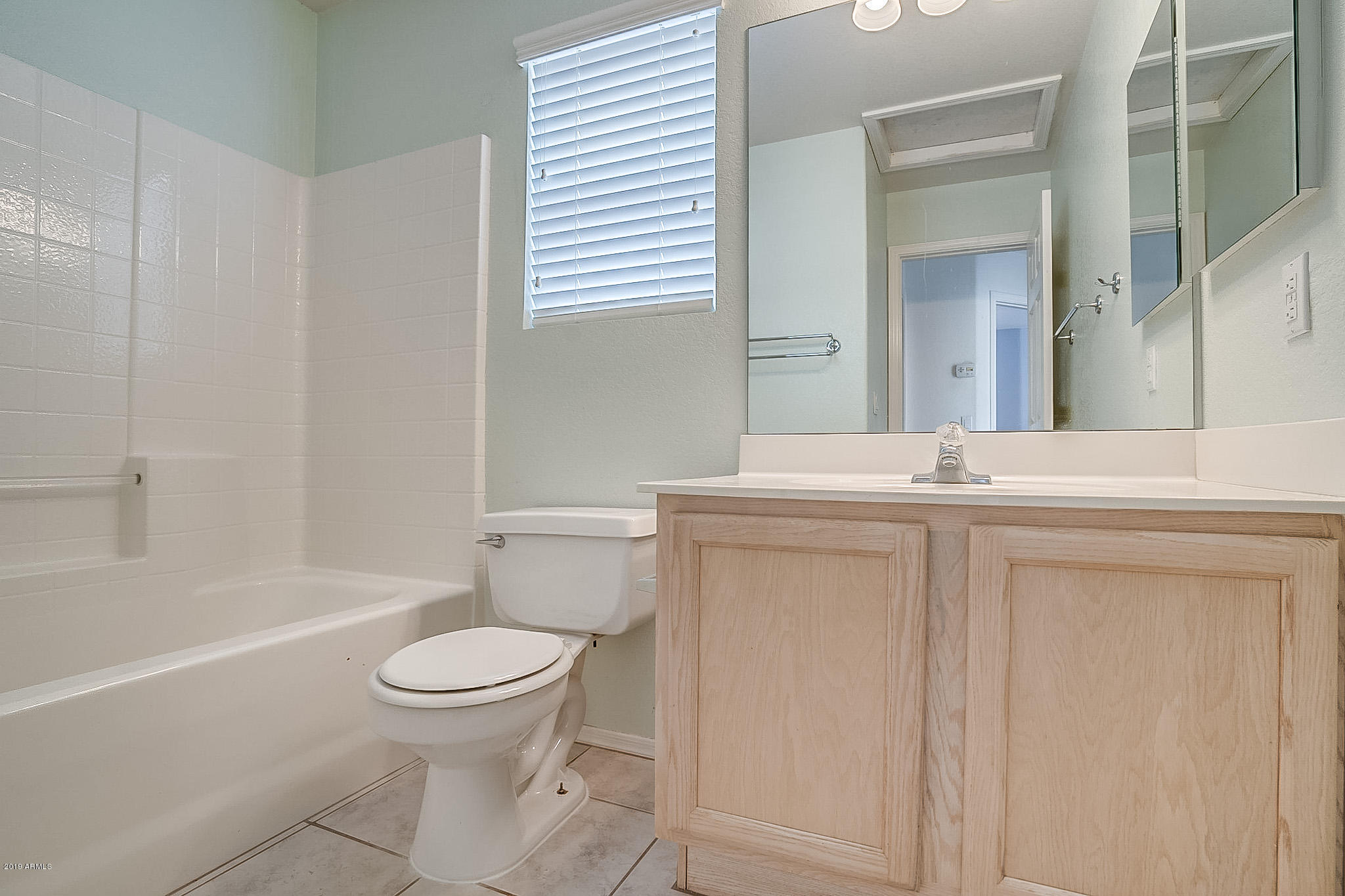 430 West Colt Road Tempe, AZ 85284 - Photo 17 of 18 a bathroom with a sink toilet and shower
