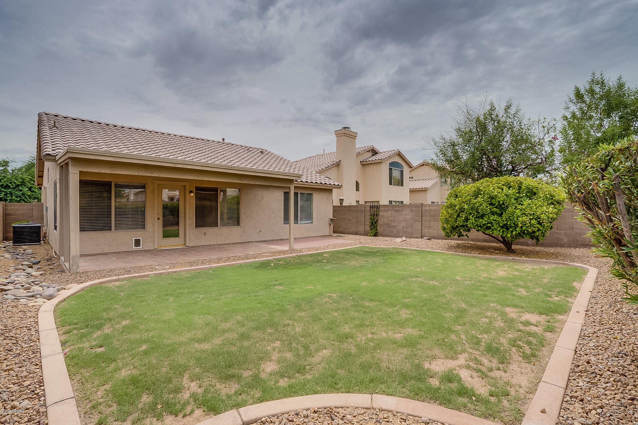 430 West Colt Road Tempe, AZ 85284 - Photo 5 of 18 a view of a house with a backyard