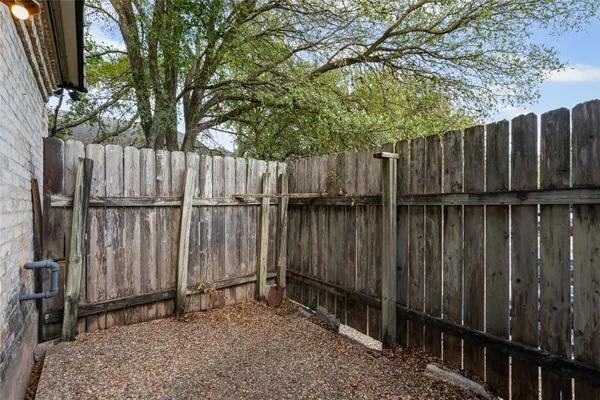 a view of outdoor space with wooden fence