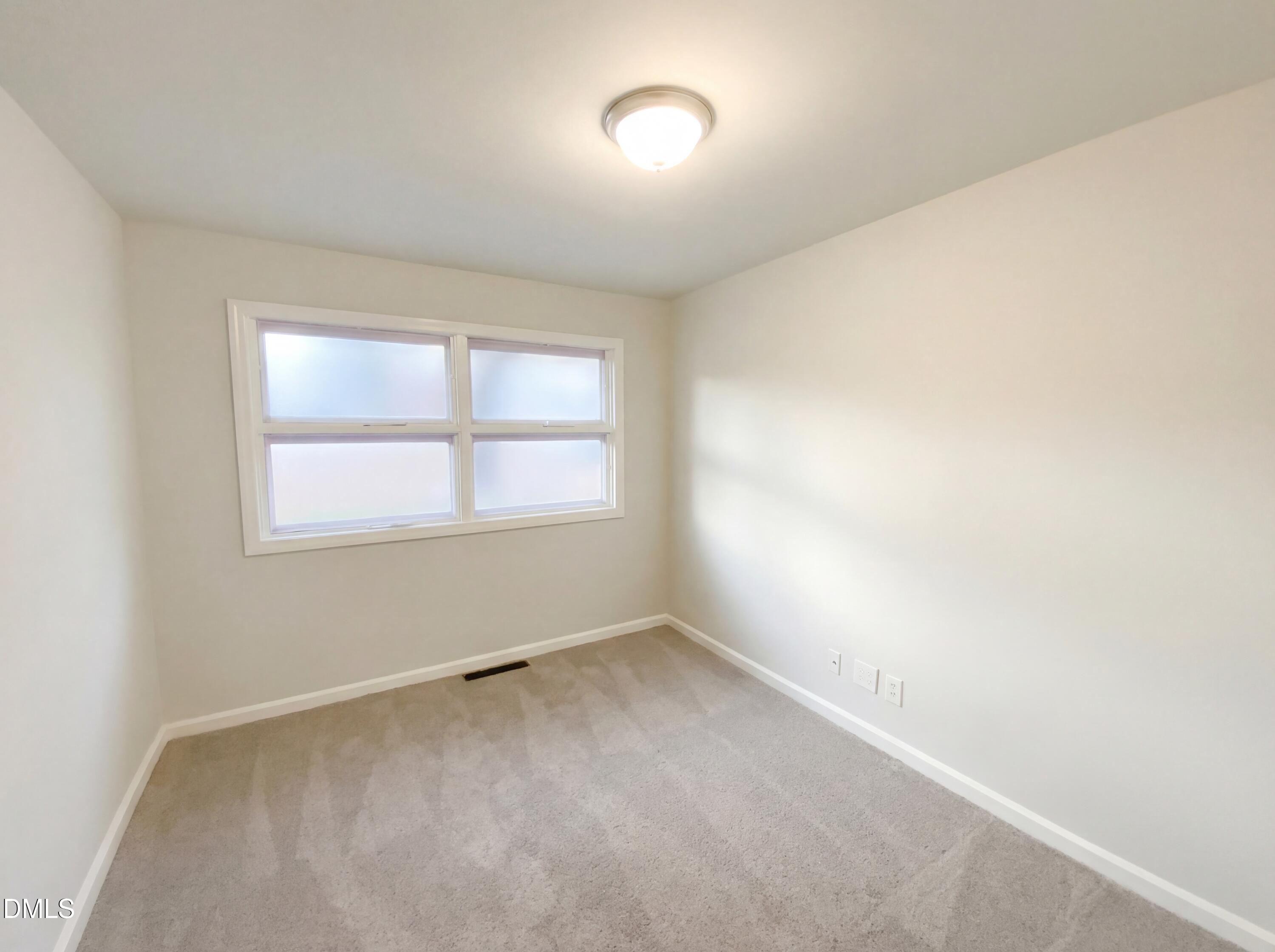2602 Crestline Avenue Raleigh, NC 27603 - Photo 15 of 17 an empty room with a window