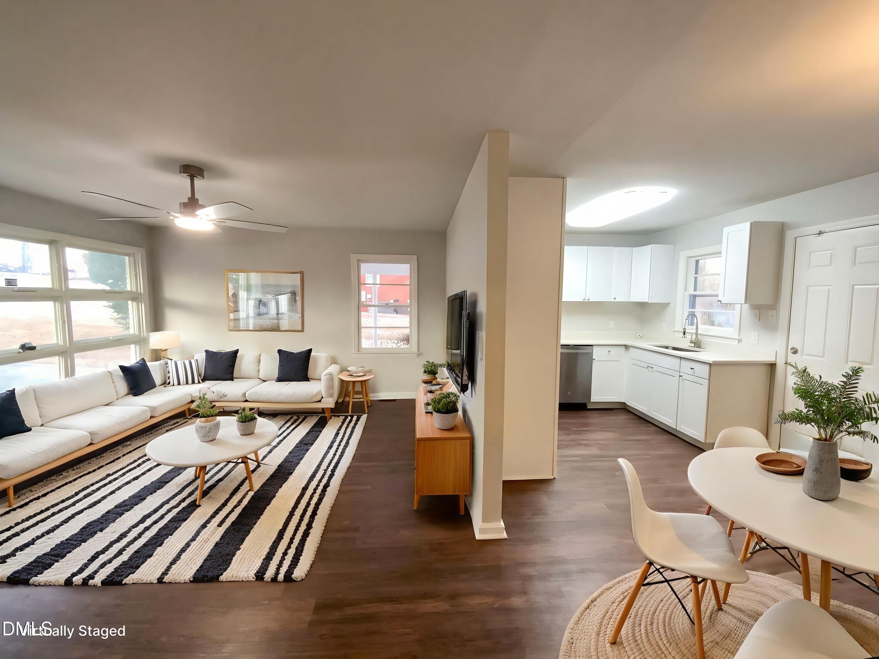 2602 Crestline Avenue Raleigh, NC 27603 - Photo 5 of 17 a living room with furniture and a wooden floor