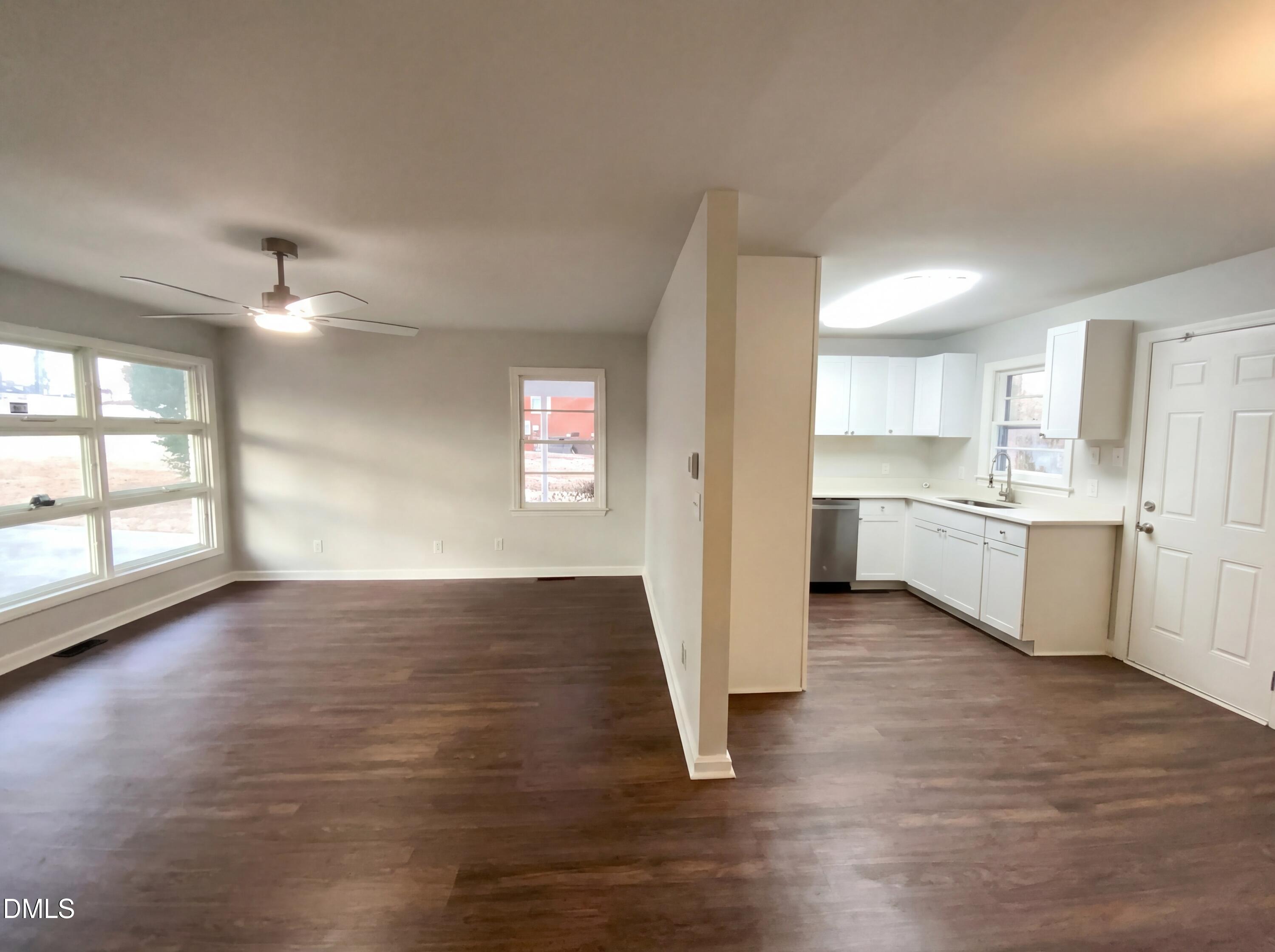 2602 Crestline Avenue Raleigh, NC 27603 - Photo 6 of 17 a view of a kitchen with wooden floor and a kitchen