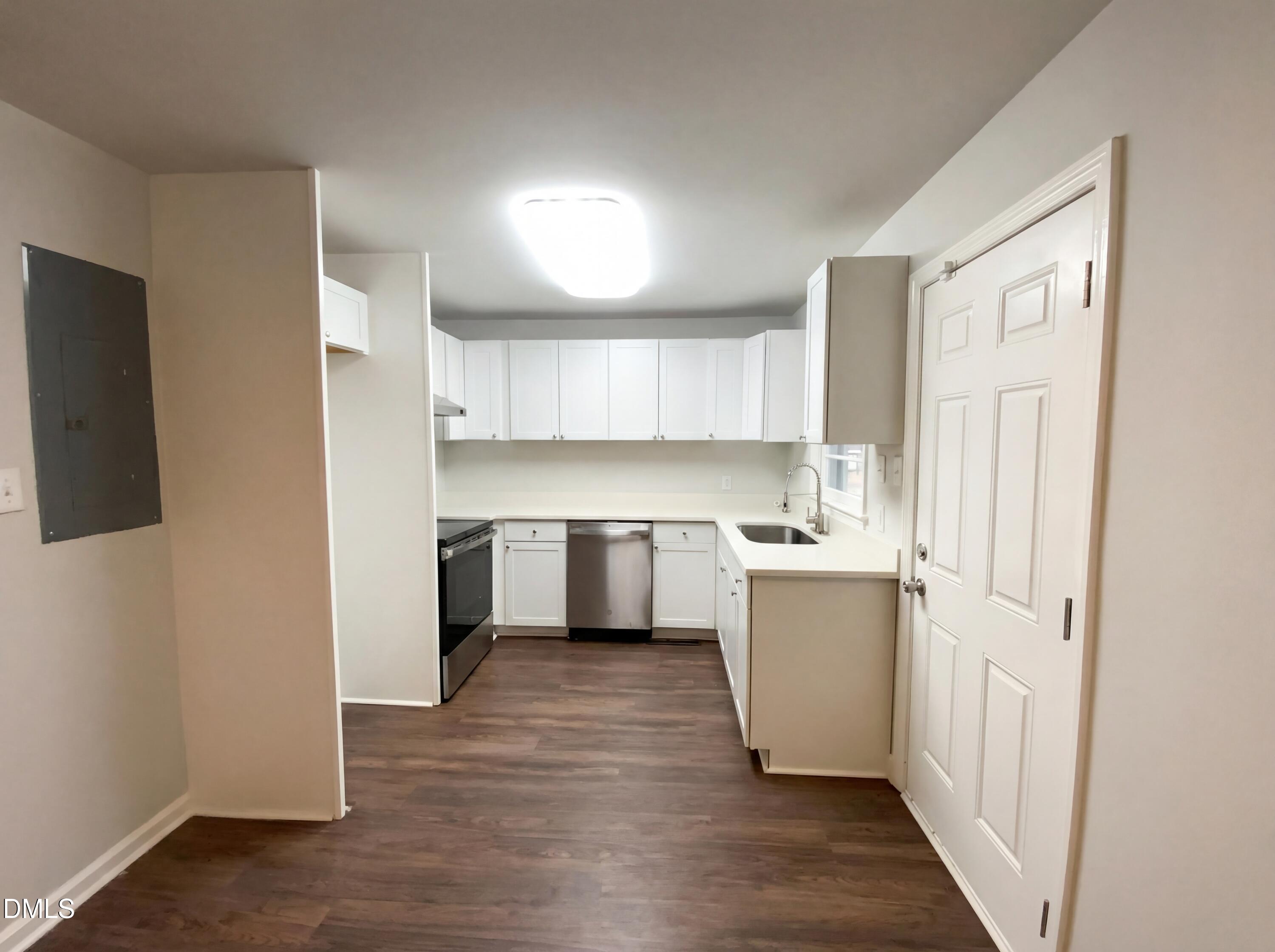 2602 Crestline Avenue Raleigh, NC 27603 - Photo 7 of 17 a kitchen with a refrigerator and a sink