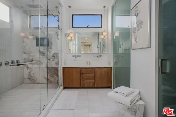 a bathroom with a bathtub and a shower