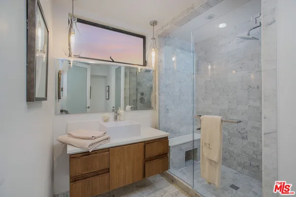 a bedroom with a bed and a table