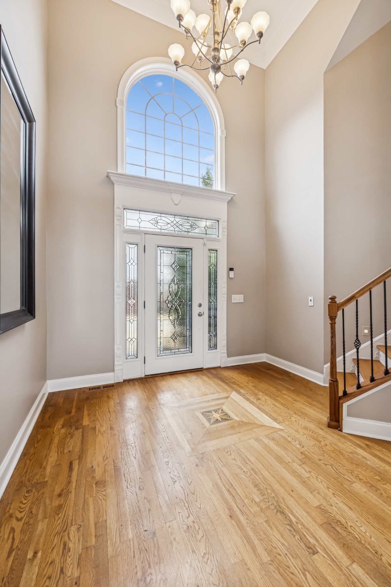 413 Stockbridge Way Mount Juliet, TN 37122 - Photo 21 of 49 a view of an empty room with wooden floor and a window