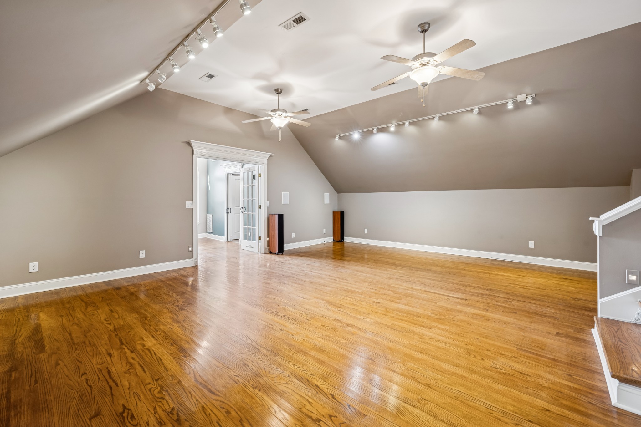 413 Stockbridge Way Mount Juliet, TN 37122 - Photo 37 of 49 an empty room with wooden floor and ceiling fan