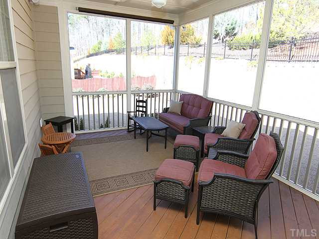 12924 Edsel Drive Raleigh, NC 27613 - Photo 21 of 25 Relax on your screened porch through out the year in NC. Plenty of space to add a TV. Speakers and HDMI are included! Screened Porch