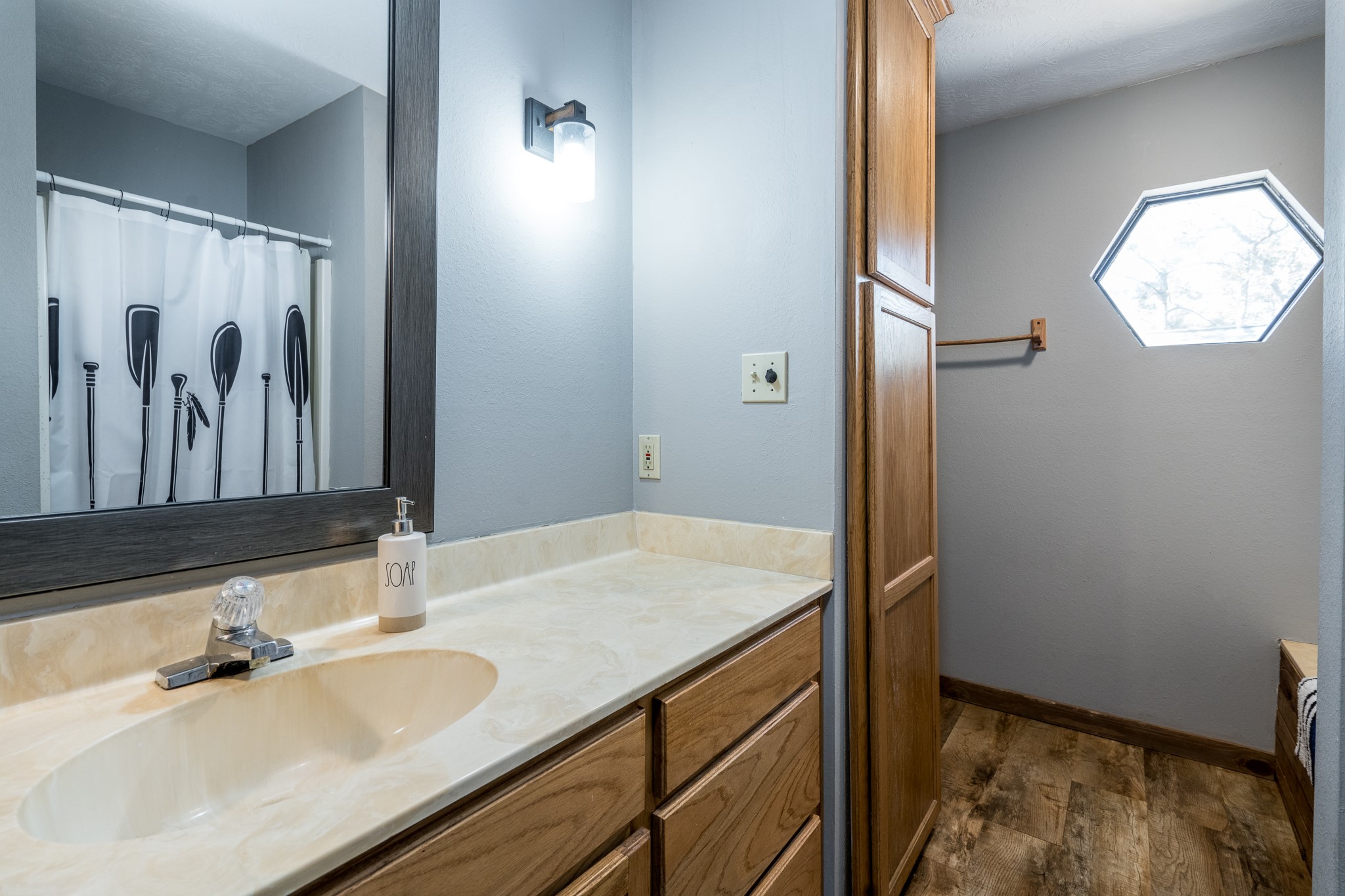 97 Greenway Drive Trinity, TX 75862 - Photo 26 of 49 a bathroom with a sink and a mirror