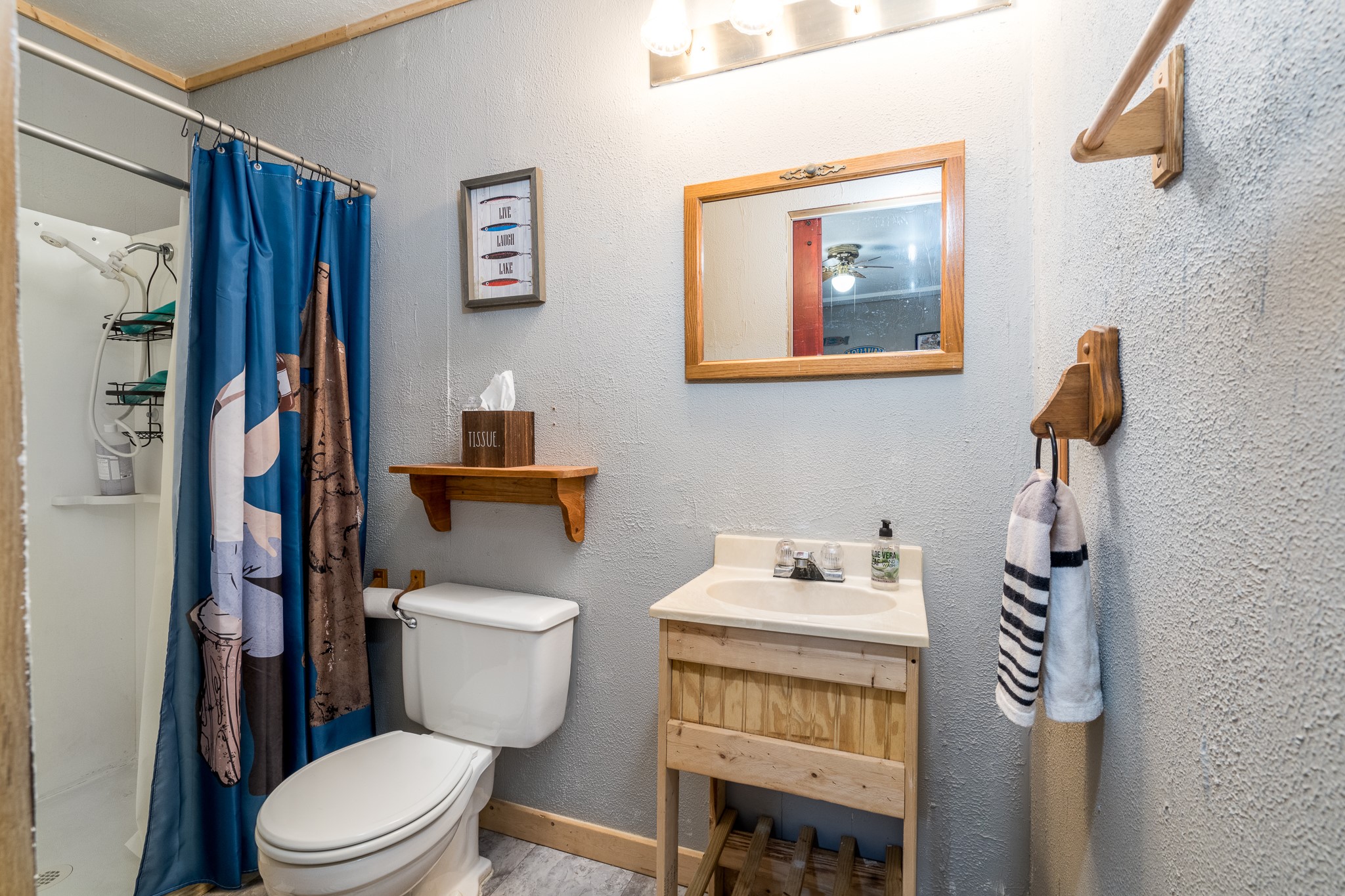 97 Greenway Drive Trinity, TX 75862 - Photo 37 of 49 a bathroom with a toilet a sink and a mirror