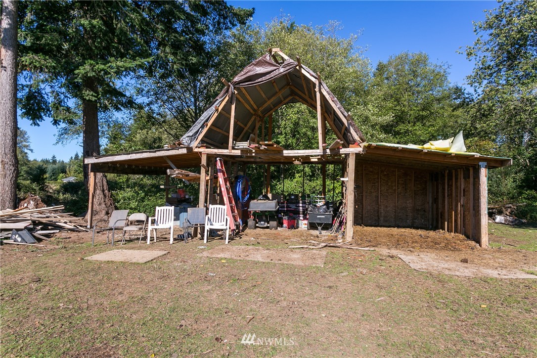 8655 Valley View Road Custer, WA 98240 - Photo 22 of 25 a view of a wooden deck with chairs and a table