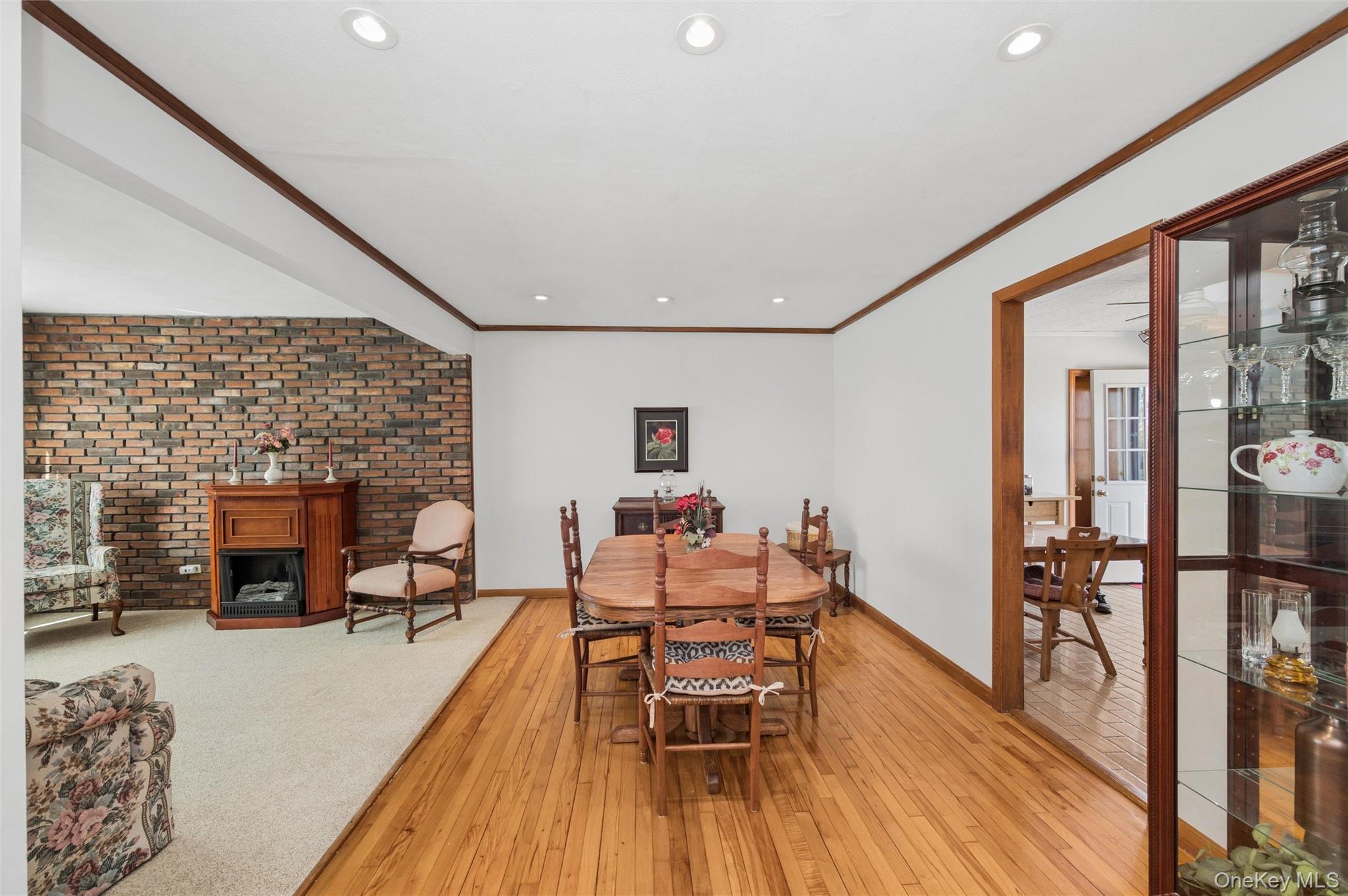 310 South 16th Street Lindenhurst, NY 11757 - Photo 20 of 23 a dining room with furniture and wooden floor