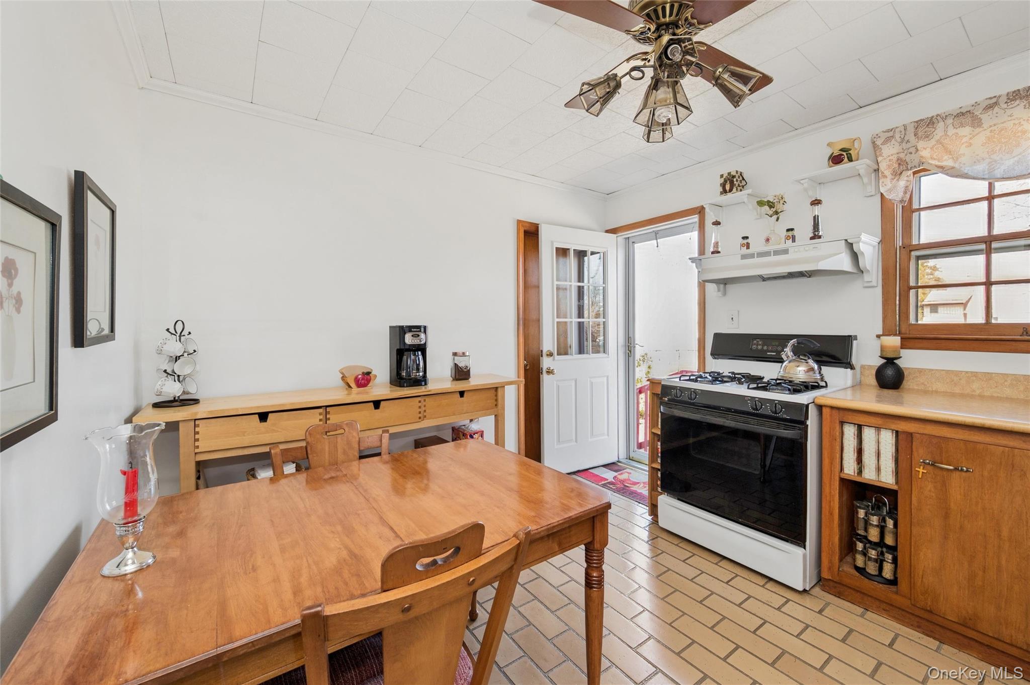 310 South 16th Street Lindenhurst, NY 11757 - Photo 5 of 23 a kitchen with stainless steel appliances a stove a sink and a refrigerator