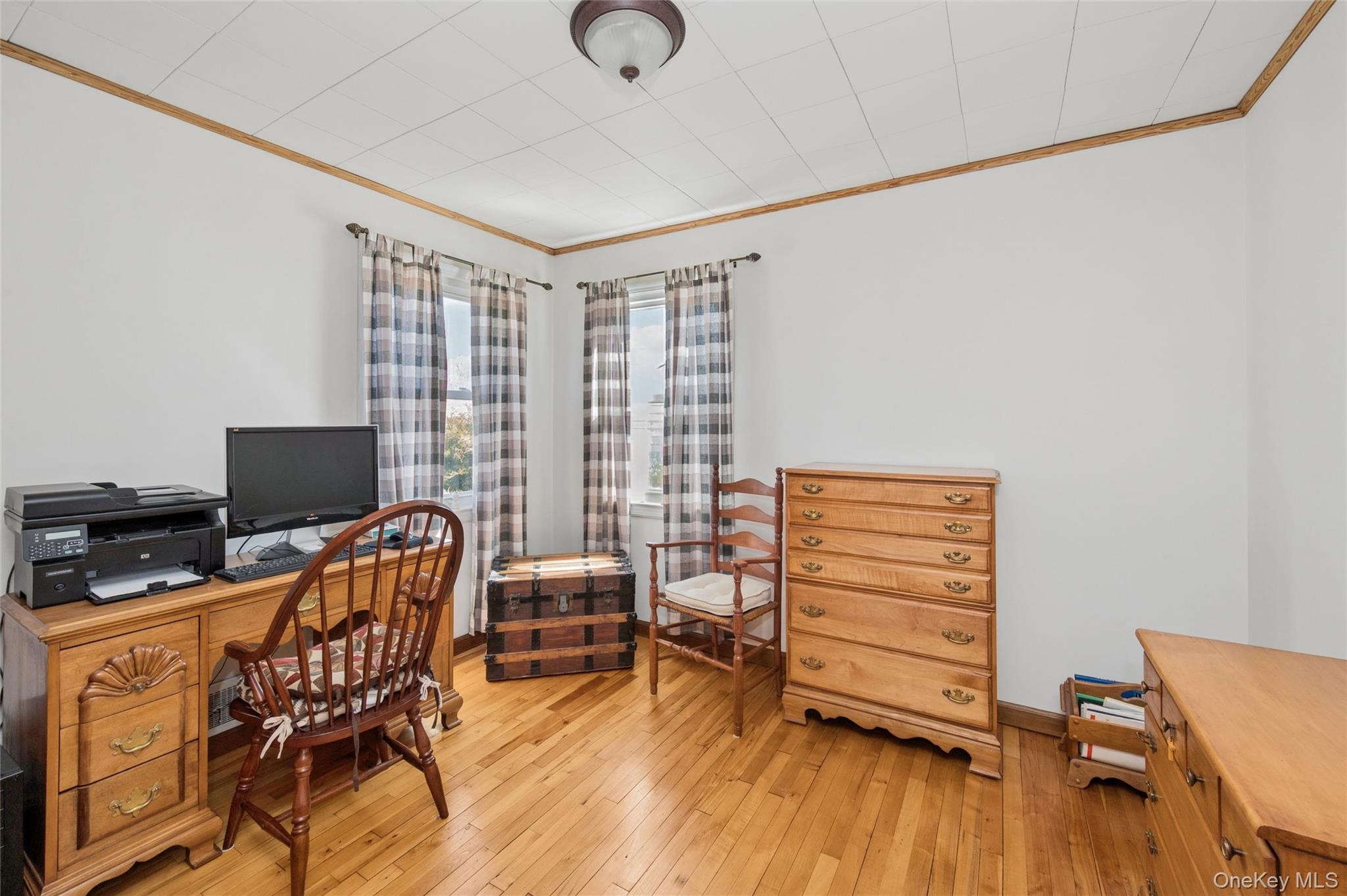 310 South 16th Street Lindenhurst, NY 11757 - Photo 7 of 23 a view of a workspace with furniture and a window