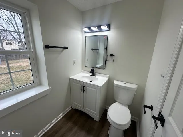 a bathroom with a bathtub and a window