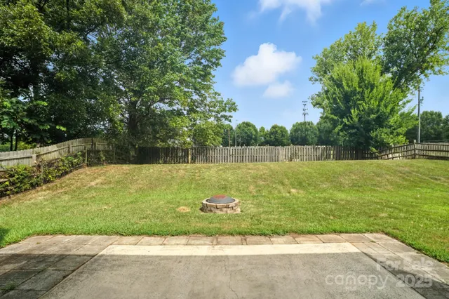 a view of swimming pool with a yard