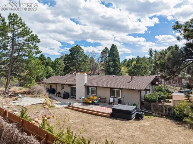 a aerial view of a house with swimming pool and sitting area