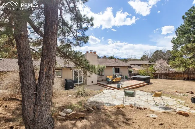 a view of a backyard with sitting area