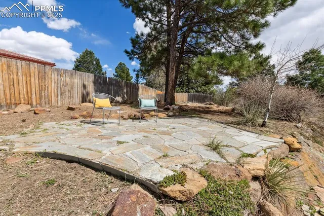 a view of a backyard of the house