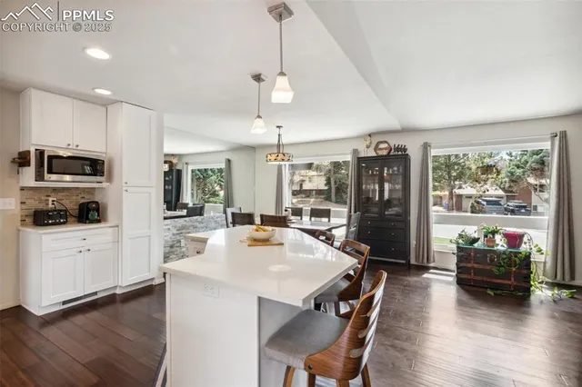 a view of kitchen with sink and wooden floor