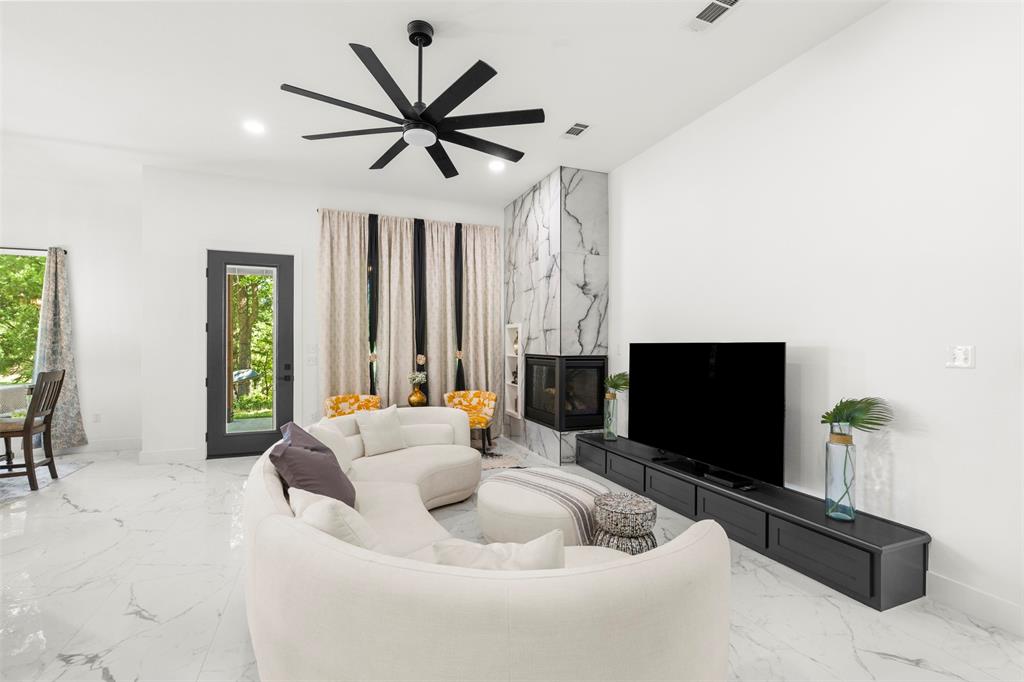 265 Shadow Oaks Streetman, TX 75859 - Photo 5 of 40 a living room with furniture and a flat screen tv