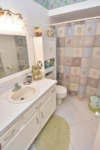 a bedroom with a bed and a night stand