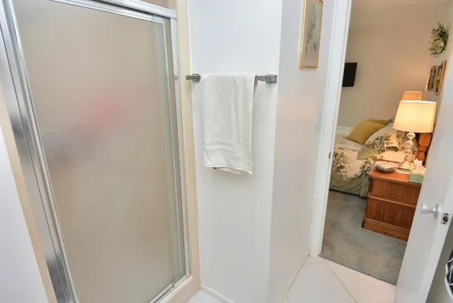 a view of a chair and tables in patio