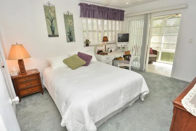 a bathroom with a sink a toilet and shower curtain