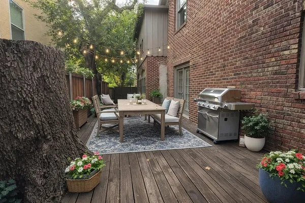 a view of a chairs and table in backyard of the house