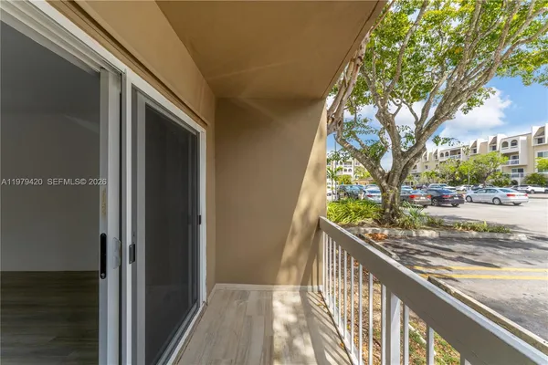 a view of a balcony and trees