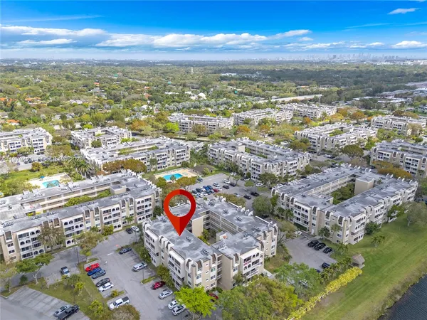 an aerial view of residential building with an ocean view
