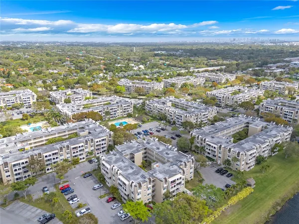 an aerial view of residential building with parking space