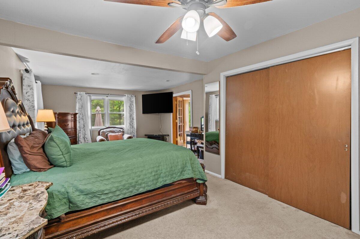 3315 Aspen Road Kunkletown, PA 18058 - Photo 31 of 32 a bed room with a bed and a chandelier