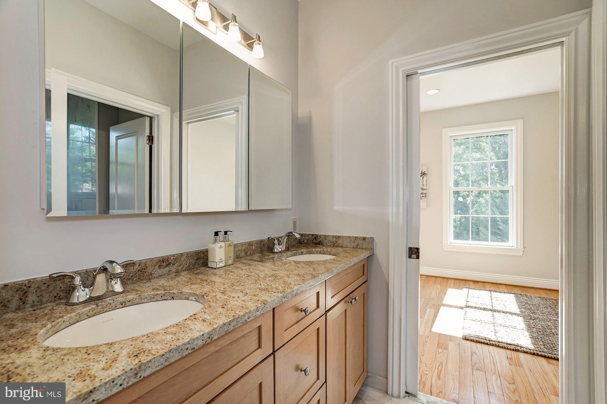 3 Sunset Drive Alexandria, VA 22301 - Photo 16 of 47 a bathroom with a granite countertop sink and a mirror