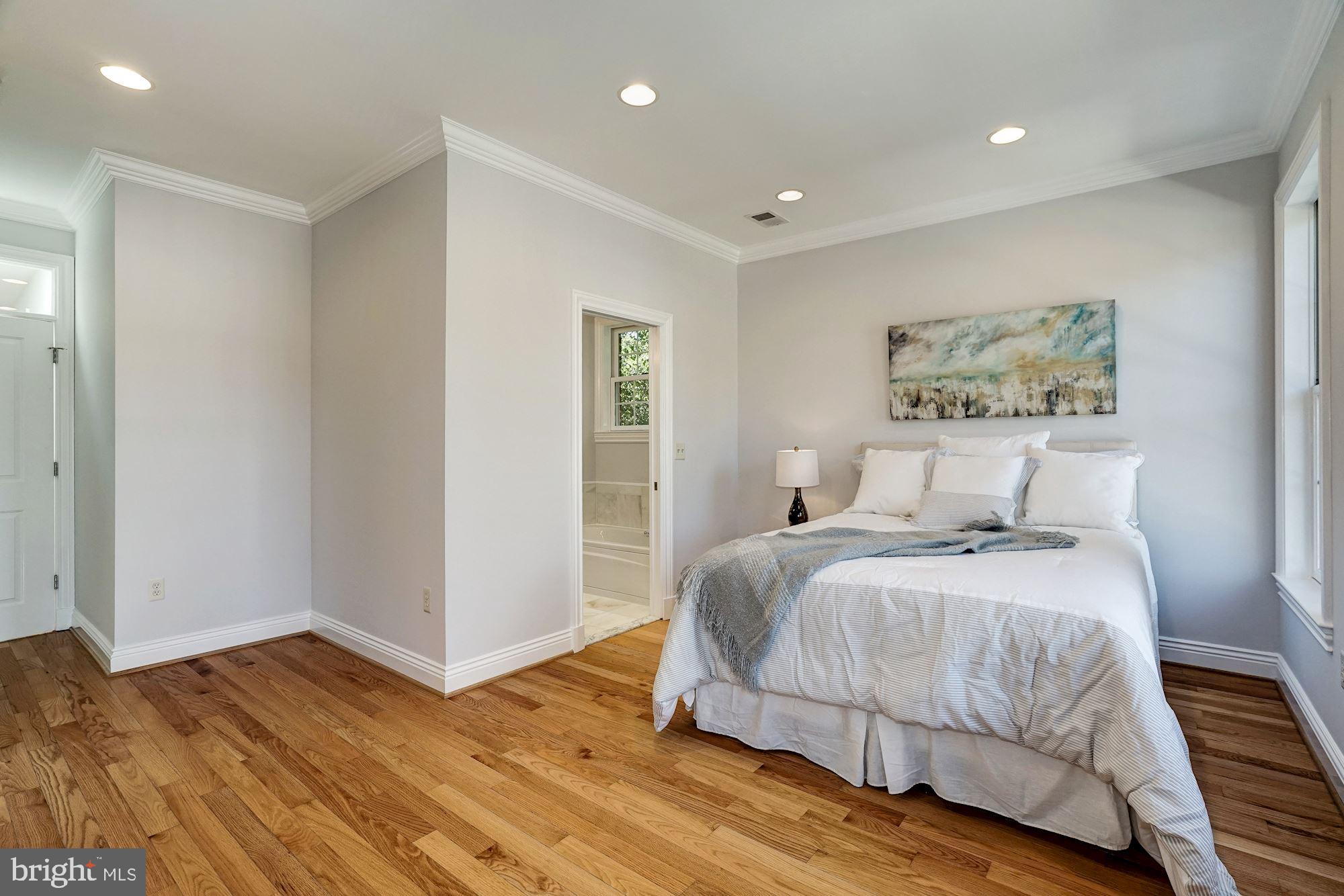 3 Sunset Drive Alexandria, VA 22301 - Photo 18 of 47 a bedroom with a bed and wooden floor