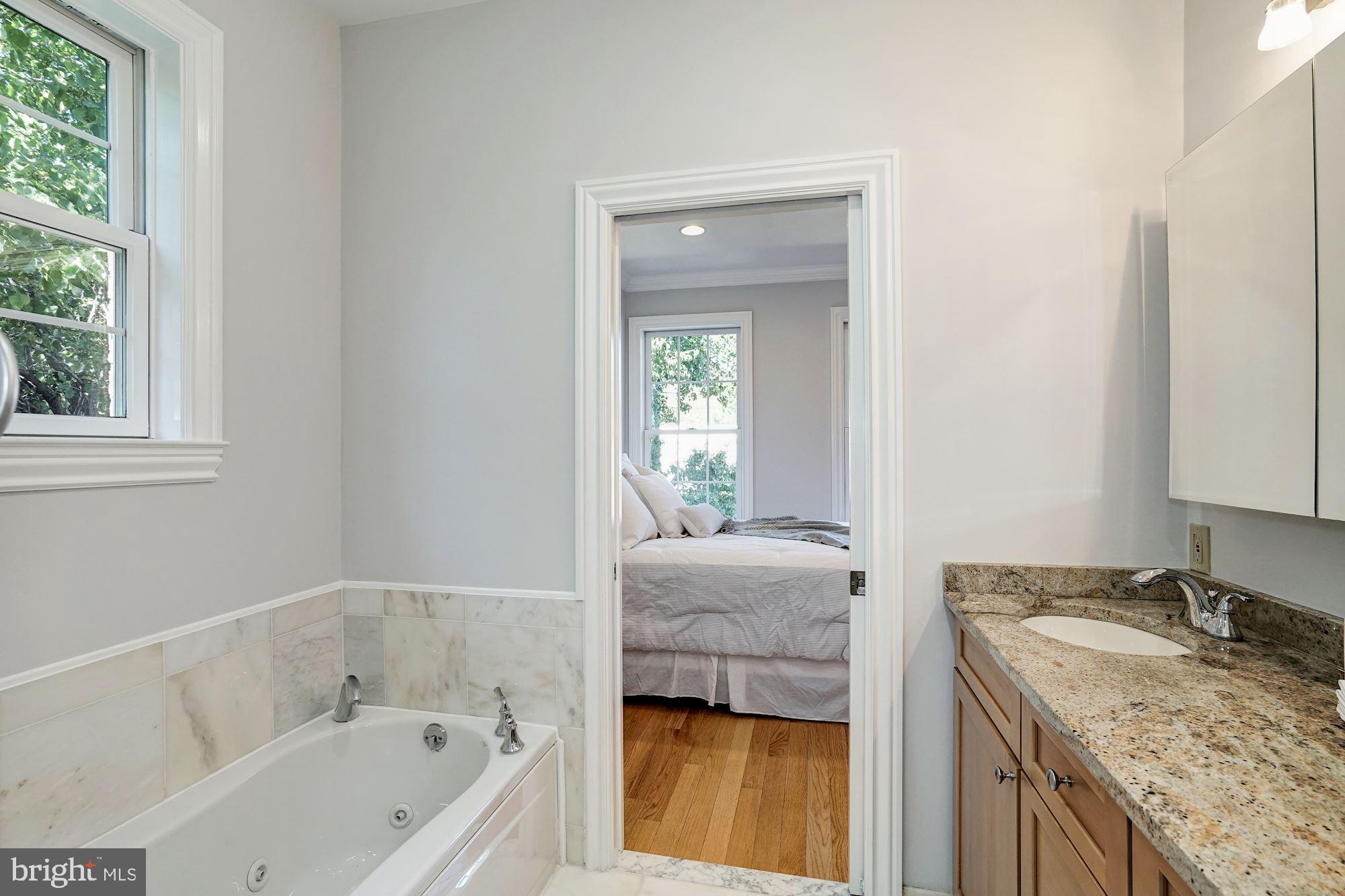 3 Sunset Drive Alexandria, VA 22301 - Photo 20 of 47 a en suite bathroom with a granite countertop tub sink and mirror