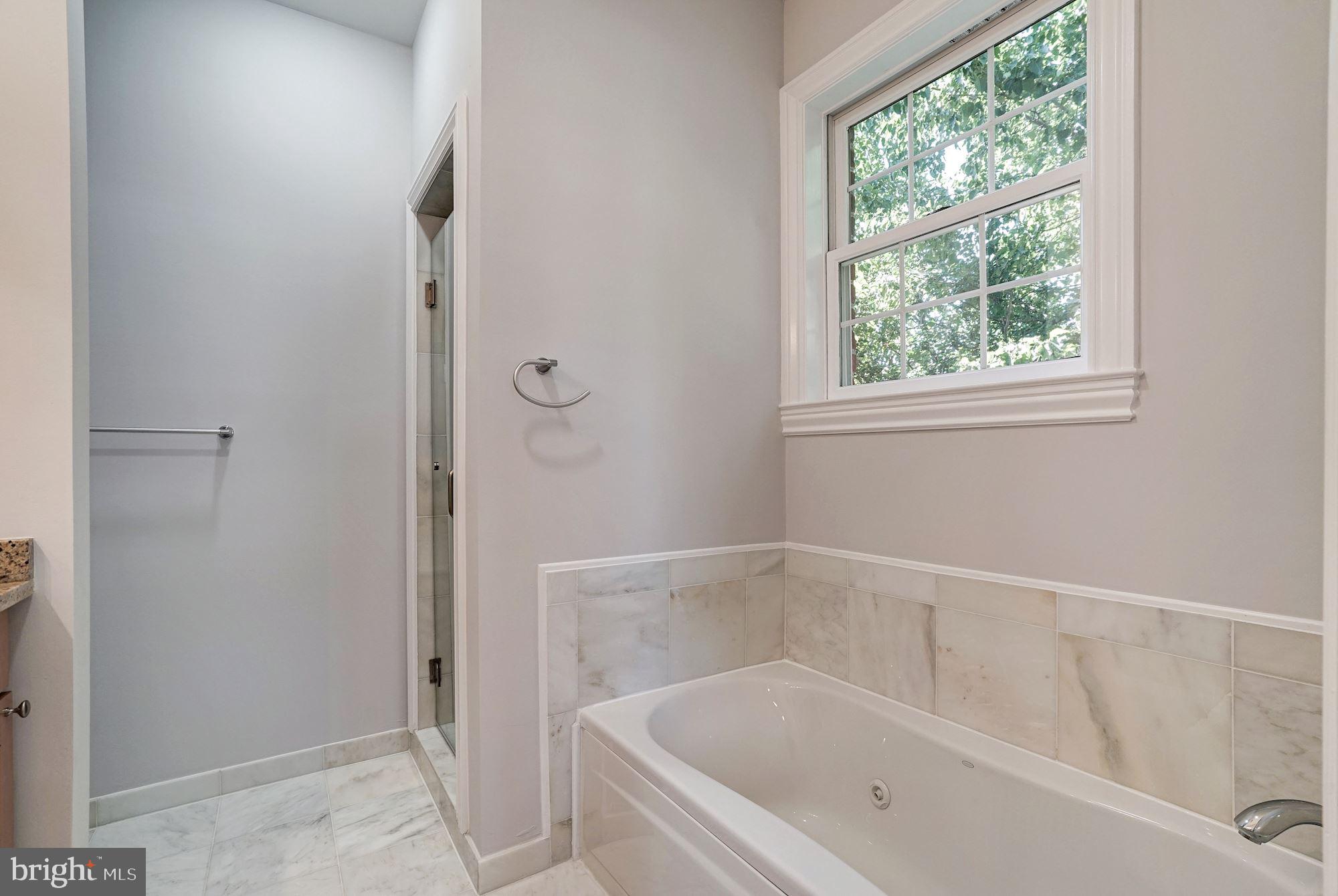 3 Sunset Drive Alexandria, VA 22301 - Photo 22 of 47 a white bath tub sitting next to a window